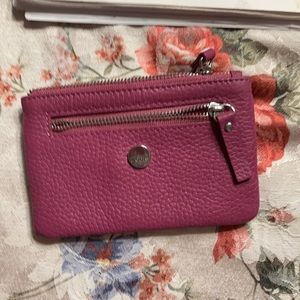 Magenta coin purse/ID holder.  Fits in pocket.